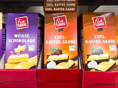 Variety of fin carre chocolate bars on display in supermarket shelf. clipart