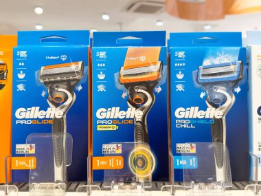 Gillette proglide razors display on store shelf with packaging details. clipart