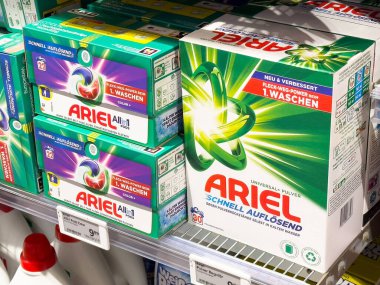 Ariel laundry detergent boxes displayed on a supermarket shelf showcasing vibrant packaging and branding for effective cleaning solutions healthy laundry concept clipart