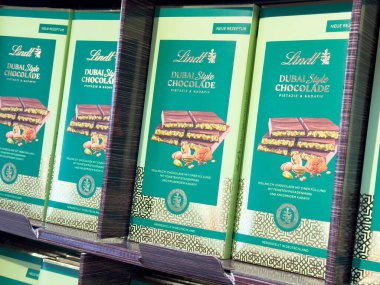 Lindt dubai style chocolate bars with pistachio and hazelnut display. clipart