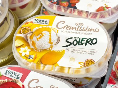 Cremissimo solero ice cream with exotic fruit sauce in recyclable packaging. clipart