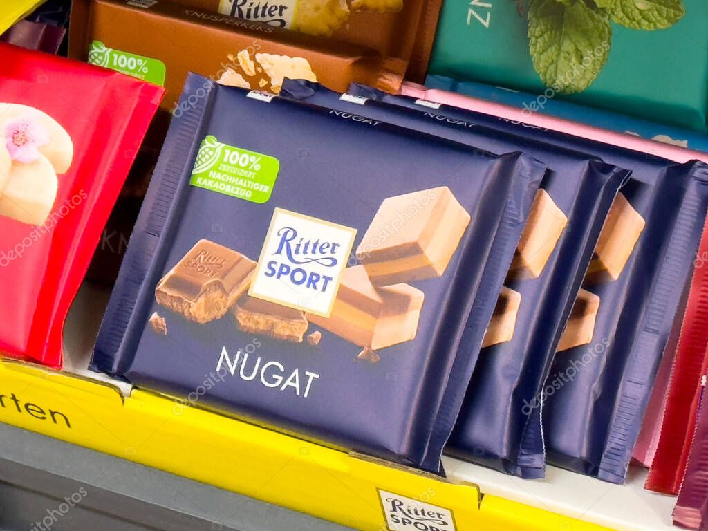 Ritter sport nougat chocolate bars displayed on shelf.