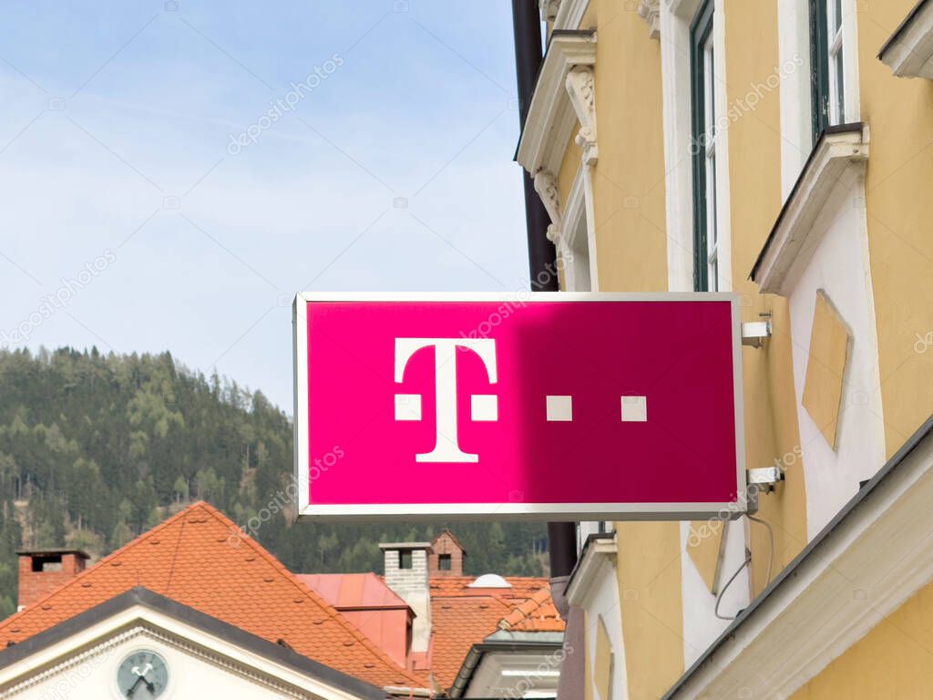 T-mobile store sign on building facade in mountain town.