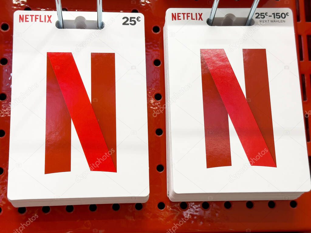 Netflix gift cards on display in store for purchase options.