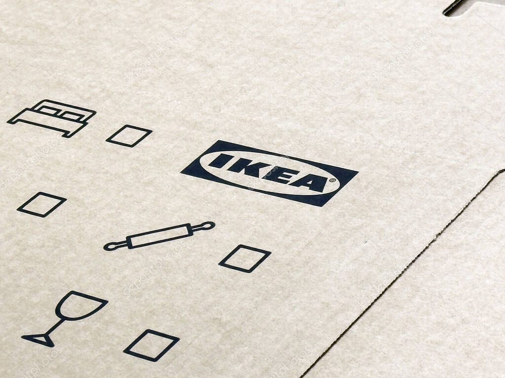 Ikea cardboard box with icons for furniture and kitchen assembly.