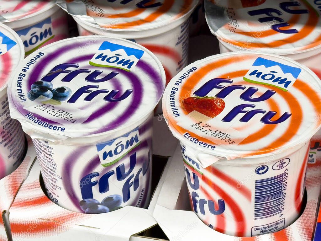 Selection of fru fru yogurt cups with strawberry and elderberry flavors.