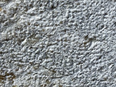 Doğal desenli sert beyaz taş yüzeyinin yakın çekim dokusu.