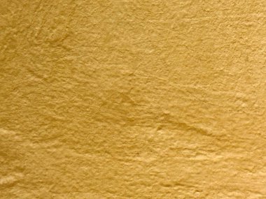 Doğal kırışıklıkları ve kıvrımları olan desenli sarı kağıt yüzey..