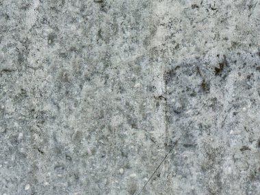 Pis gri beton yüzeyin detaylı dokusu.