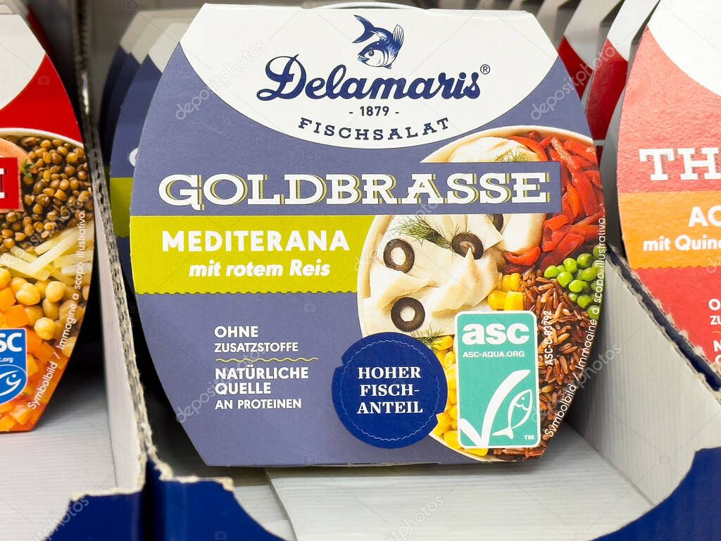 Mediterranean fish salad with red rice in blue packaging with nutritional info.