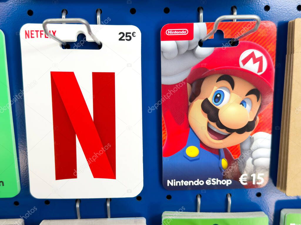 Netflix and nintendo eshop gift cards display on rack in store.
