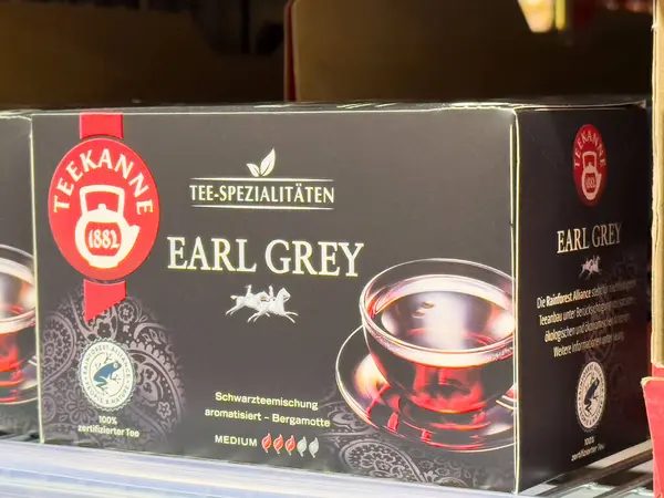 Teekanne Earl Gri çay kutusu, Alman metni ve siyah çay fincanı resmi..