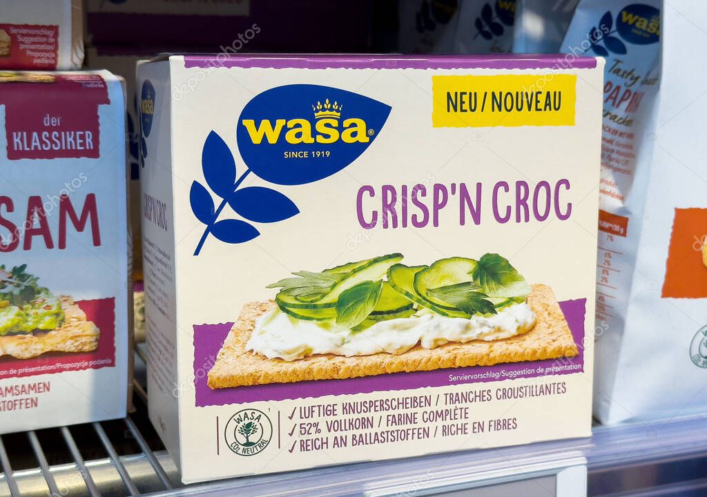 Wasa crisp'n croc crackers box with cheese and greens topping on store shelf.