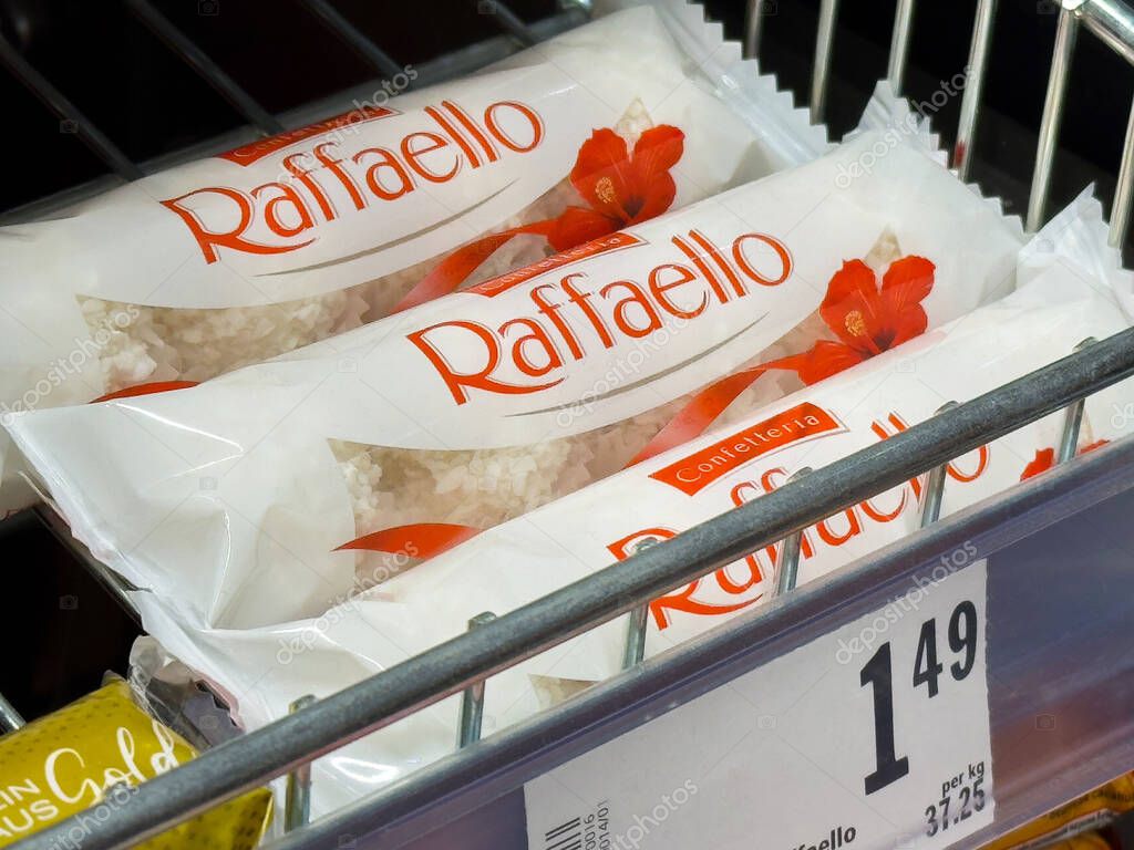 Raffaello coconut almond treats on retail shelf with price tag display.