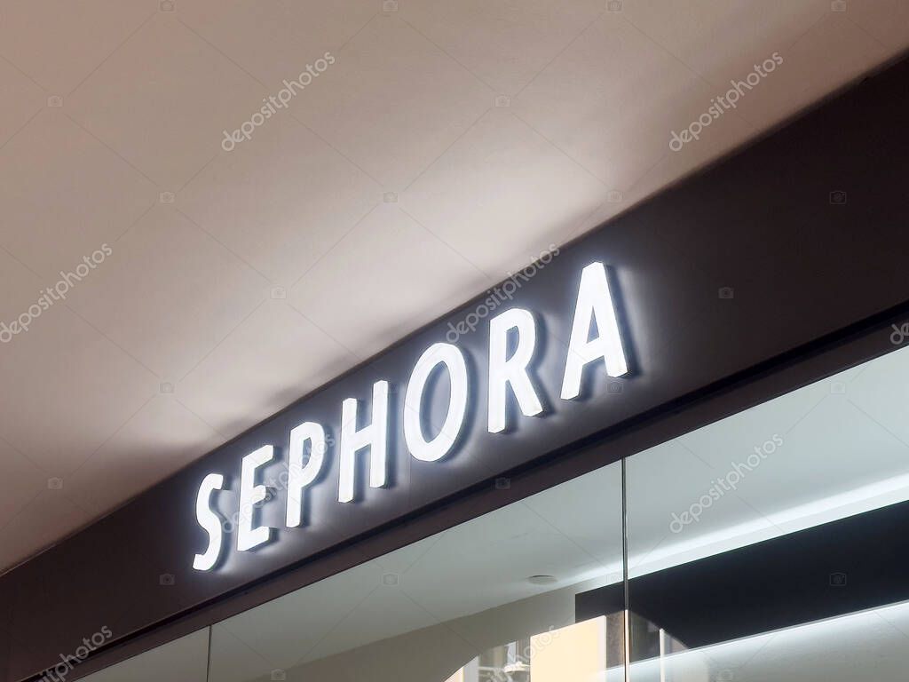 Sephora storefront signage with illuminated white letters on black background.