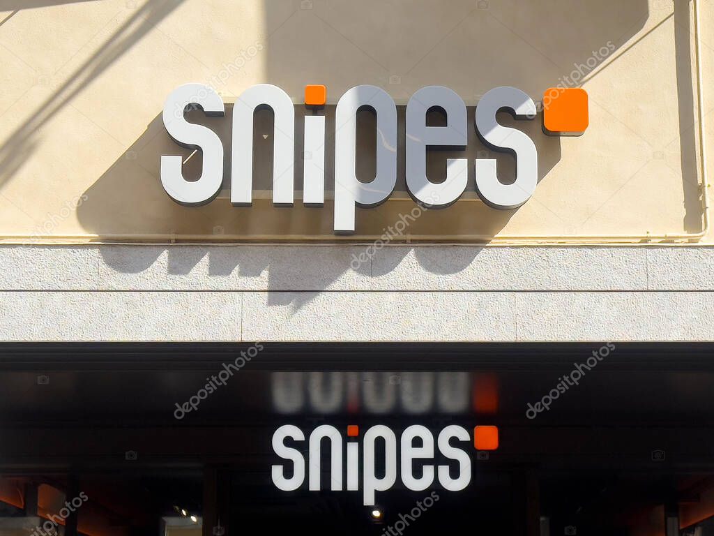 Snipes storefront signage with modern design and bold typography.