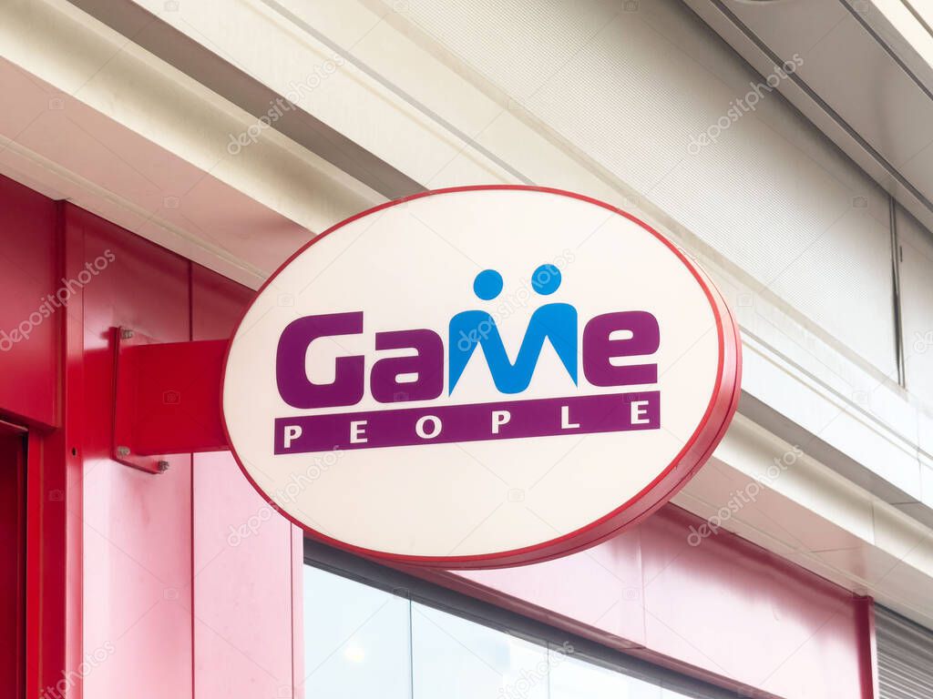 Game people storefront sign with red exterior and logo.