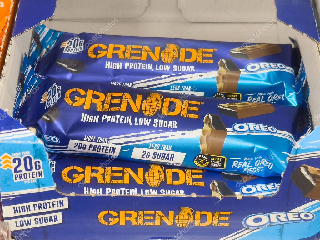 Grenade oreo protein bars displayed in box with nutritional labels.