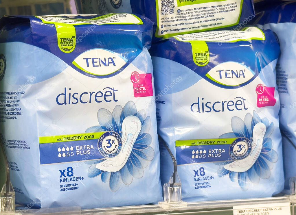 Tena discreet extra plus incontinence pads on store shelf.