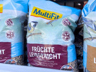 Birdseed packaging with multifit label and blue tit image.