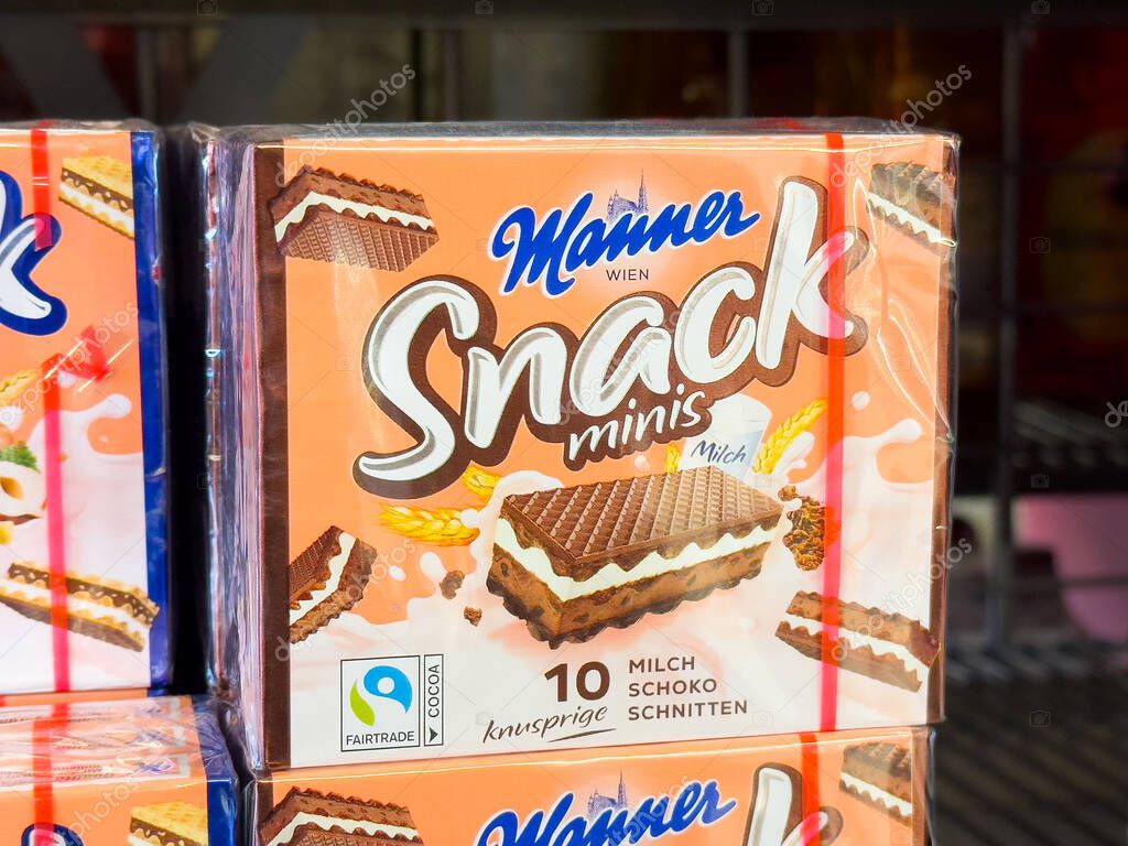 Manner snack minis chocolate wafers in packaging display at supermarket shelf.