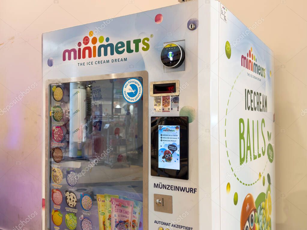 Ice cream vending machine with mini melts branding in retail space.