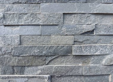 Yatay desenli gri tuğlaları olan desenli taş duvar arkaplanı.