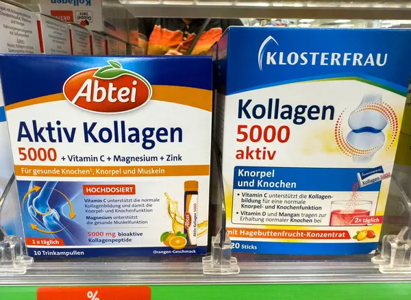 Villach, Avusturya - 18 Ağustos 2025: Abtei ve Klosterfrau kolajen takviyeleri, eklemler ve kaslar için sağlık faydalarının vurgulandığı bir eczane rafında belirgin bir şekilde sergilenmektedir