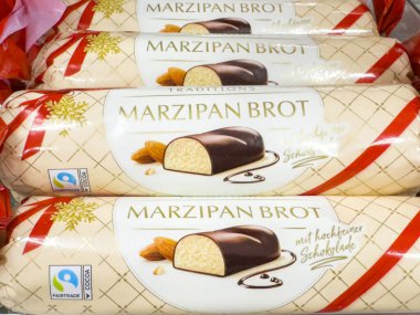 Villach, Austria - September 28, 2025: Marzipan bread with chocolate coating is beautifully arranged in festive packaging, perfect for holiday gifting