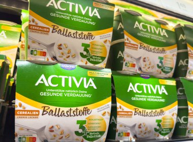 Ljubljana, Slovenia - October 02, 2025: Activia yogurt boxes arranged on store shelf, highlighting healthy digestion and multibiotic advantages for health-conscious shoppers