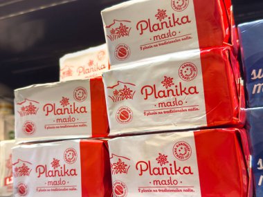 Ljubljana, Slovenia - October 02, 2025: Planika maslo butter is displayed on a supermarket shelf, highlighting its traditional packaging and quality ingredients