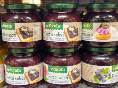 Ljubljana, Slovenia - October 02, 2025: Natureta fruit preserves jars displayed in a supermarket, featuring colorful labels and enticing flavors for culinary inspiration