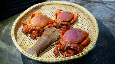 Spanner Crab or seafood is stored in a woven container of bamboo or ayakaan
