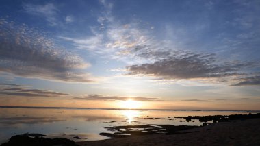 Sunset on the beach. Paradise beach. Tropical paradise, white sand, beach,  and clear water. Landscape with sea sunset on beach.