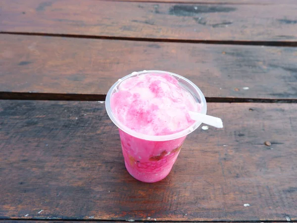 Ice podeng or Pink drink on a wooden table