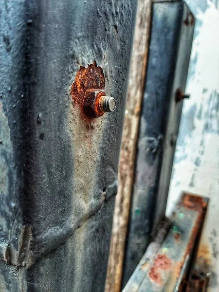 old rusty paint on an iron door