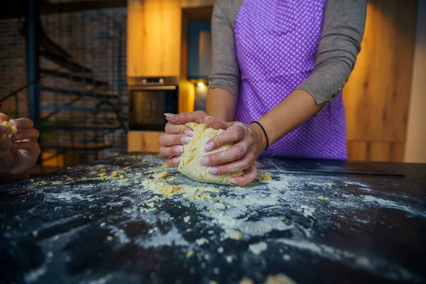 Hands kneading dough for pasta,pizza,bread or cookies with gluten free flour