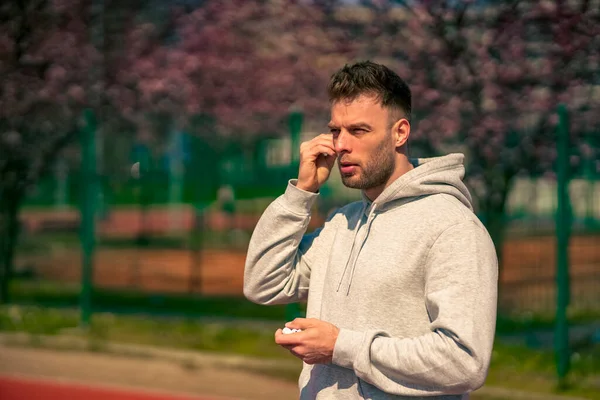Handsome Athlete Getting Ready Run Outdoors While Putting Headphones — Stock Photo, Image