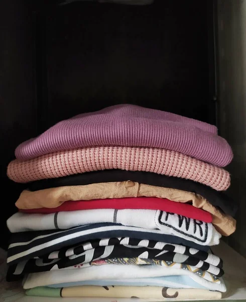Pile Colored Clothes Closet Dark Background — Stock Photo, Image