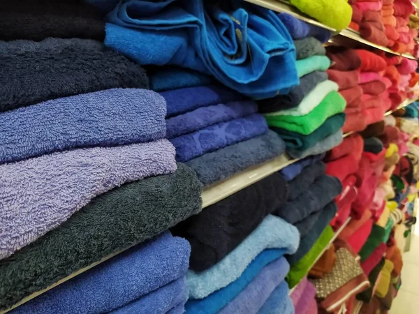 stock image Display of multicolor towels in the shop