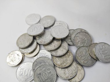 Collection of Indonesian rupiah coins on a white background