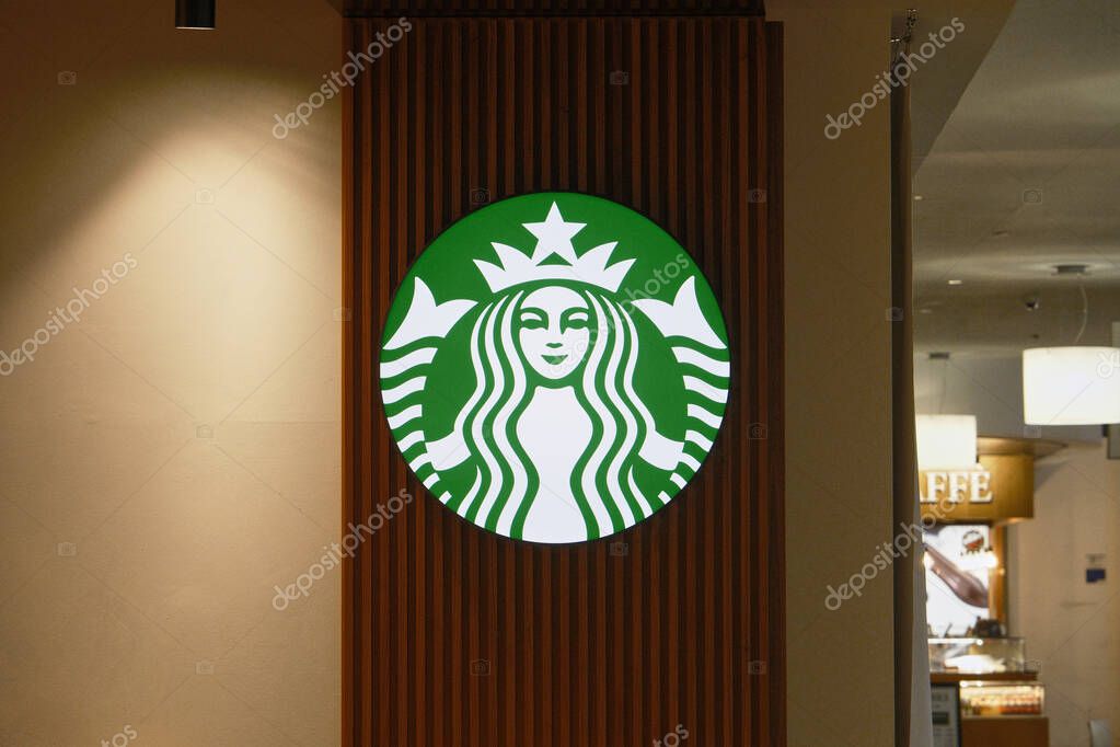 The Starbucks logo at the Starbucks store in Roma Termini, the main railway station in Rome, the capital of Italy.