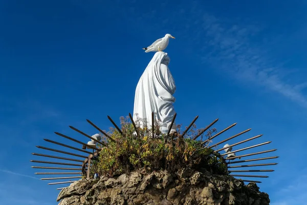 stock image Image of the Virgin of the Rock in Biarritz with a seagull on her head