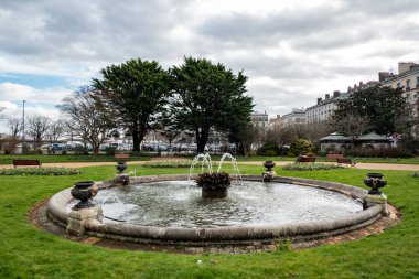 Fountain with fountains in the garden of Bayonne on a cloudy day