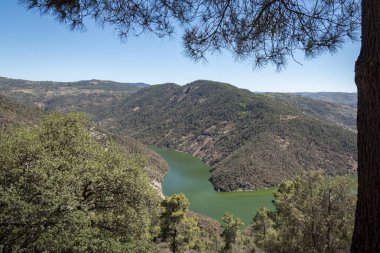 Between hills and mountains the river Tua in the background in Sao Mamede de Ribatua, Portugal