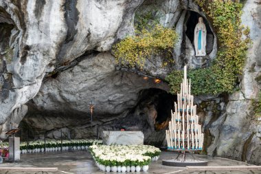 Grotto of the Apparition where Our Lady appeared to Bernadette Soubirous in the Sanctuary of Lourdes in the city of the Pyrenees, France clipart