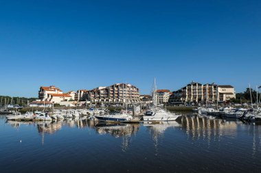 View over the harbor and part of the city of Capbreton in France clipart