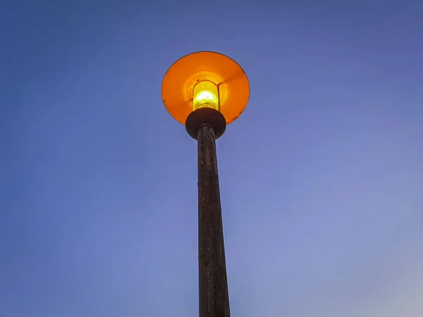 Street light pole lit up at night