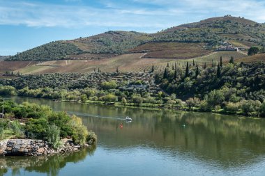 Between hills and mountains and some vineyards, the Douro river in Foz Tua, Tras os Montes Portugal