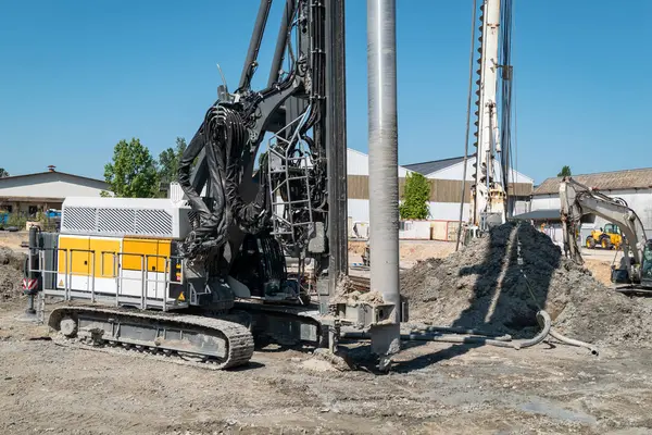 stock image Operating with Precision: Stacking and Drilling Equipment on Construction Site
